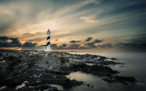 Lighthouse Rocks Stones Sunset Ocean HD wallpaper thumb