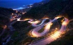 Bend along the tortuous downhill road at night wallpaper thumb