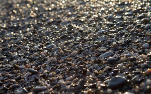 Beach pebbles in the sunrise wallpaper thumb