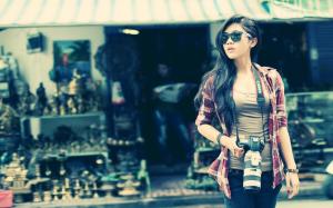 Asian girl with a camera wallpaper thumb