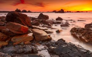 Coast, sea, stones, sunset, red sky wallpaper thumb