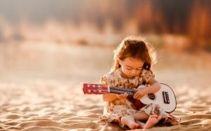 Cute Little Girl Playing Guitar wallpaper thumb