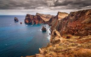 Beautiful scenery of the sea, coast rock cliff dark clouds wallpaper thumb