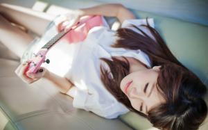 Girl lying bed, guitar, music wallpaper thumb