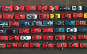 Many different Ferrari supercars in the road wallpaper thumb
