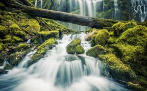 Beautiful waterfall in forest, stones, green moss wallpaper thumb
