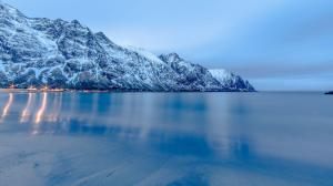 Lights reflecting in the frozen mountain lake wallpaper thumb