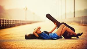 Guitar girl lying on road, sunlight wallpaper thumb