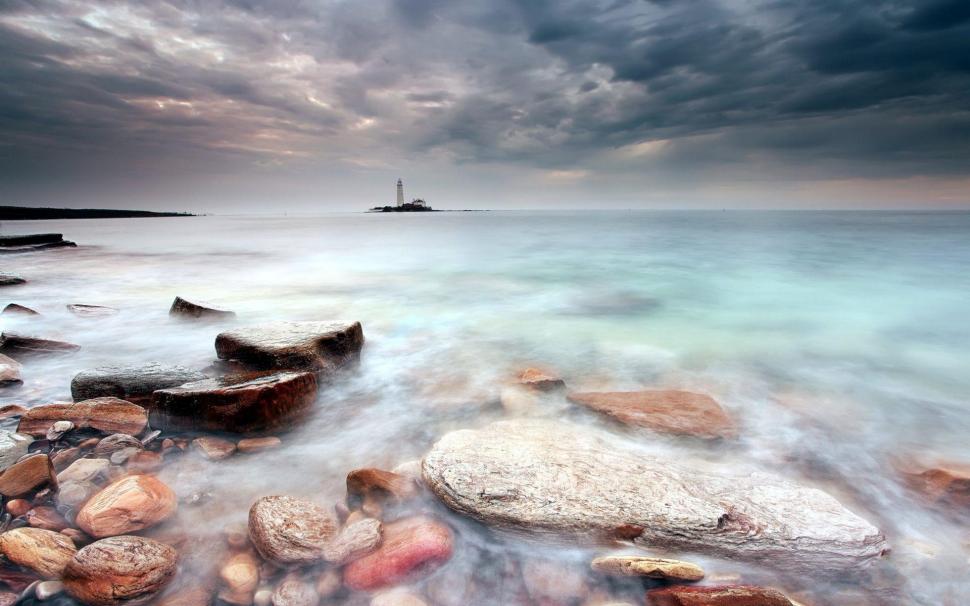Calm sea under the stormy sky wallpaper,nature HD wallpaper,1920x1200 HD wallpaper,cloud HD wallpaper,rock HD wallpaper,lighthouse HD wallpaper,1920x1200 wallpaper