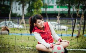 Girl playing football wallpaper thumb