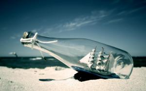 Ship in a bottle on the beach wallpaper thumb
