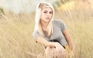 Blonde girl in the summer grass wallpaper thumb