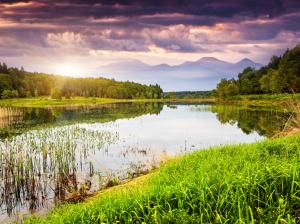Nature landscape, lake, water, grass, trees, mountains, sky, sunset, clouds wallpaper thumb