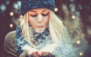 Blonde girl playing with snow wallpaper thumb