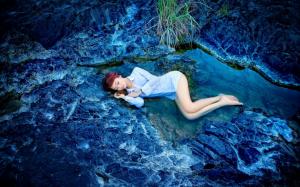 Sleeping girl, rocks, water, blue style wallpaper thumb