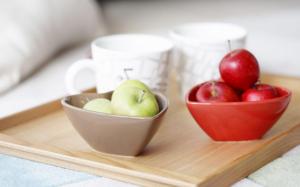 Green and red apples on a tray wallpaper thumb