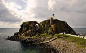 Lighthouse Coast Buildings Rocks Stones Ocean Widescreen Resolutions wallpaper thumb