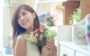 Beautiful Asian girl, holding flowers wallpaper thumb