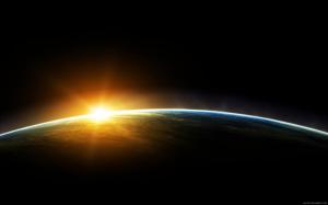 Sun behind the Earth in space wallpaper thumb