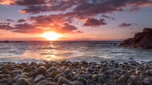 Sunset Sunlight Ocean Rocks Stones Shore Beach HD wallpaper thumb