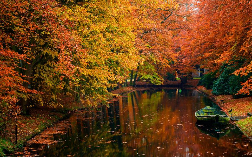 Autumn River With Boat wallpaper,lake HD wallpaper,color HD wallpaper,nice HD wallpaper,leaves HD wallpaper,cano HD wallpaper,shore HD wallpaper,water HD wallpaper,boat HD wallpaper,tranquility HD wallpaper,river HD wallpaper,riwer HD wallpaper,still water HD wallpaper,2560x1600 wallpaper