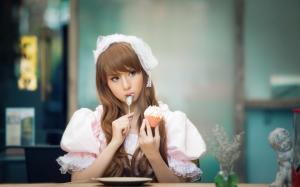 Beautiful Asian girl eating cake, lovely dress wallpaper thumb