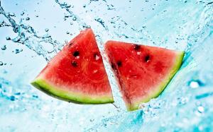Watermelon pieces falling into the water wallpaper thumb