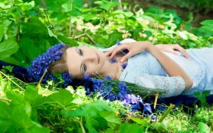 Beautiful woman laying in the grass wallpaper thumb